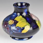 Moorcroft squat pedestal vase decorated in the Anemone pattern, height 8cm