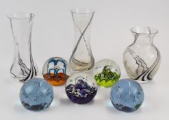 Eight Caithness glass paperweights and vases, tallest 18cm, one in original box.