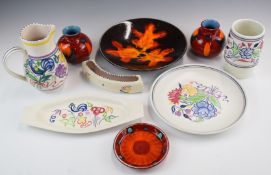 A collection of Poole pottery including a charger decorated in Autumn Leaves pattern
