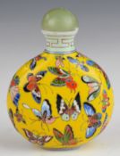 Chinese Peking glass snuff bottle with enamelled butterfly decoration and character mark to base,
