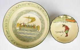 Royal Doulton Seriesware Bayeux Tapestry pedestal bowl and a golfing Seriesware dish, largest