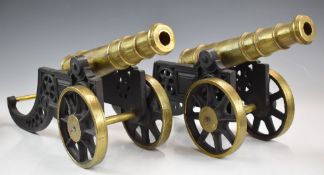 Pair of brass desk or signalling cannon on brass carriage, overall length 47cm