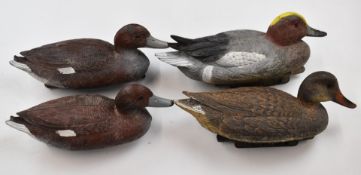 Four Sportplast and similar plastic floating duck decoys.