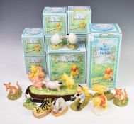 Royal Doulton twelve Winnie The Pooh figures including Christopher Robin, Eeyore Looses A Tail,