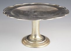 Chinese silver tazza with engraved decoration of a stork in flight amongst pine trees, with