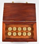 A set of 10 wooden and brass shooting butt markers in the form of shotgun cartridges numbered 1-