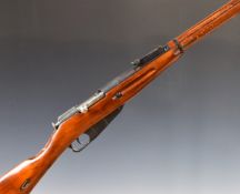 Deactivated Russian Mosin Nagant 7.62 bolt-action rifle with adjustable sights, canvas sling, top
