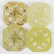 Four Chinese carved jade counters or silver winders, largest diameter 2.8cm