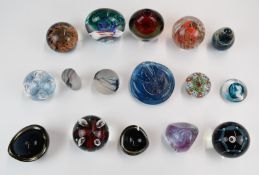 Sixteen glass paperweights and vases including Mdina, Caithness, Isle of Wight, Kosta Boda, Kaj