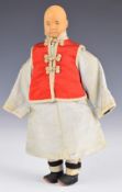 Chinese 'Door of Hope' child doll wearing a pale blue silk robe, red jacket and pink under trousers,
