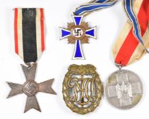 Three German Third Reich Nazi medals comprising Mother's Cross, Social Welfare Medal and War Merit