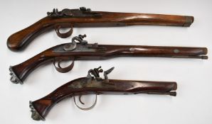 Three decorative flintlock pistols, two with lion mask butt caps, largest 48.5cm long.