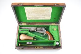 Colt 1849 .31 single-action pocket revolver with shaped wooden grips, silver plated trigger guard
