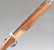 Nikko Model 5000 I 12 bore over and under ejector shotgun with engraved locks, trigger guard,