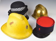 Two Gloucestershire Police hats, one by CW Headress Limited together with a Gloucestershire Fire &