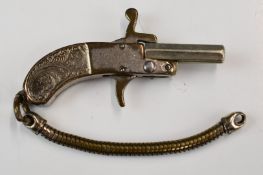 Continental miniature pinfire hammer action pistol with engraved metal grip and 0.75 inch