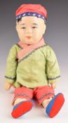 Chinese 19th / 20thC doll wearing a green silk jacket, height 40cm
