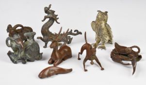 Collection of Japanese and Chinese bronze and cast metal animals including dragon, goat etc