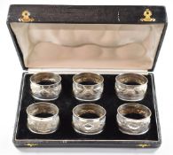 Cased set of six Eastern napkin rings marked sterling silver, width of case 22cm, weight 60g