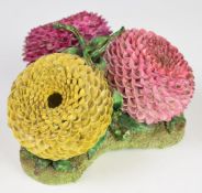 A 19thC porcelain triple stem vase in the form of three chrysanthemums, with London retailer's marks