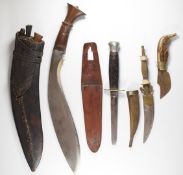 Four knives, comprising Kukri with wooden grip and sheath, Milbro dagger and oriental decorative