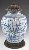 Chinese 18th / 19thC large ginger jar with carved hardwood base and cover, decorated with prunus
