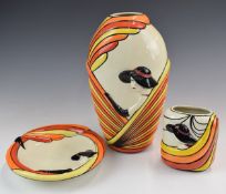 Two Lorna Bailey vases and a charger with relief moulded figural decoration in the Art Deco style,