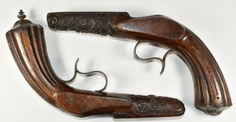 A near pair of Flobert pistol stocks, each with carved decoration, reeded grip, shaped butt plate