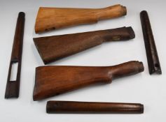 Three wooden Enfield or similar military style rifle stocks and furniture.
