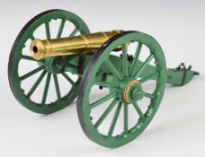 Desk or signalling cannon with brass barrel and spoked wheels, overall length 30cm