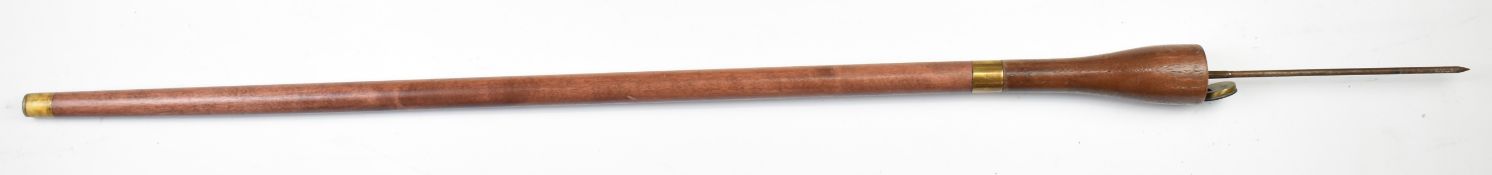 Flick stick with Queen Victoria coin to trap door, length of stick 91cm. PLEASE NOTE ALL BLADED