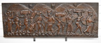 African tribal carved wooden panel decorated with slaves in procession, carved from a single