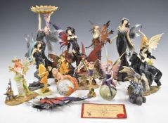 A collection of mostly fantasy figures including two by Amy Brown, tallest 28cm