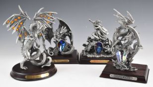 Four Tudor Mint Myth and Magic figures comprising Triumphant Wizard, Dragon Storm, The Eunectus