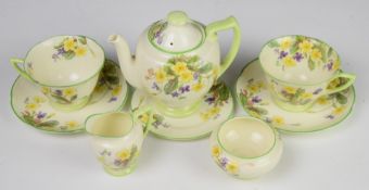 Royal Doulton Art Deco tea for two decorated in the April pattern and dated 1938, tallest 14cm