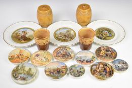 A collection of Prattware pot lids and plates including shooting bears, Winchcombe pottery beakers
