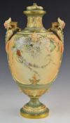 Royal Worcester blush ivory pedestal vase with twin mask handles, relief moulded detail and