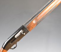 Beretta A301 12 bore three-shot semi-automatic shotgun with engraved locks, chequered semi-pistol