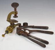 Two shotgun cartridge re-loading tools comprising a Kynoch brass 12 bore rollover tool and a