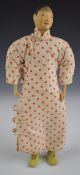 Chinese 'Door of Hope' doll wearing a red polka dot dress and under trousers, height 26.5cm