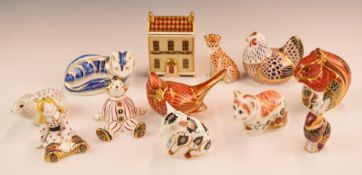 A collection of Royal Crown Derby paperweights including a house, cats, doll etc, tallest 10cm
