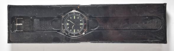 Military style watch with black webbing style strap