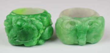 Two Chinese 19th / early 20thC carved jadeite archer's rings, one in the form of a butterfly and the