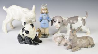 A collection of porcelain / ceramic figures including Russian calf, Copenhagen Polar Bear, Nao