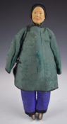 Chinese 'Door of Hope' doll wearing teal green silk jacket, purple under trousers and velvet
