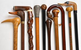Ten walking sticks / canes including unusual twisted stick with white metal wirework decoration,