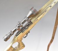 Erma .22 bolt-action rifle with laminated show wood stock, thumb hole grip, leather sling, sound