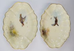 Royal Worcester pair of shaped pedestal bowls decorated with partridges in flight, W25 x D19 x H4.