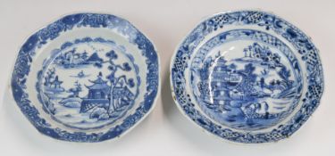 A near pair of Chinese 19thC blue and white dishes decorated with buildings in landscapes, each