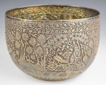 Indian silver large pedestal bowl decorated with figures in a jungle setting, signed with an